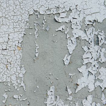 old cracked paint on the concrete wall 