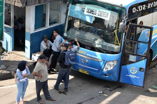 bandung, indonesia-june 16, 2014: bus parking at cicaheum bus station waiting for passenger to board.
