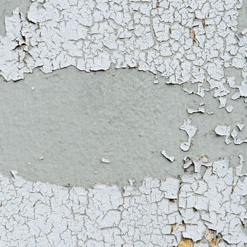 old cracked paint on the concrete wall 