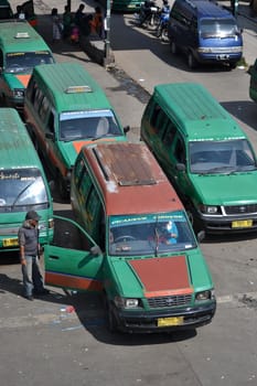 bandung, indonesia-june 16, 2014: public transportation in bandung city called angkot.