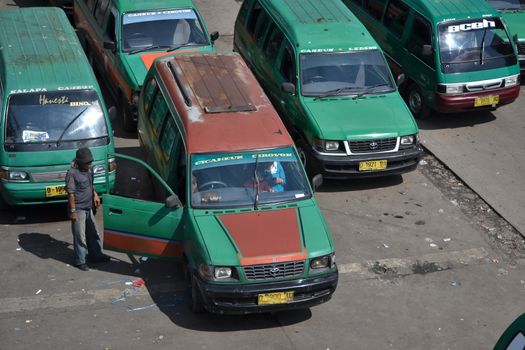 bandung, indonesia-june 16, 2014: public transportation in bandung city called angkot.