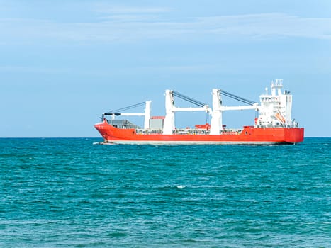 Empty cargo ship sailing in the sea