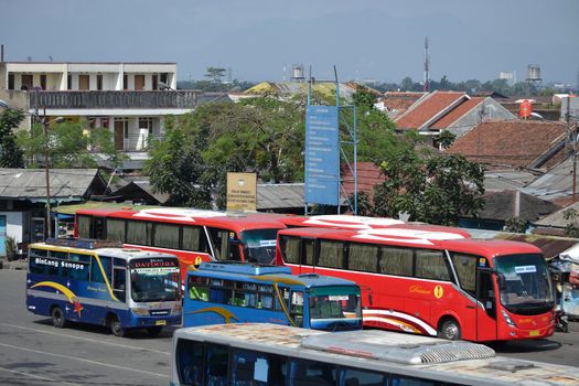 bandung, indonesia-june 16, 2014: bus parking at cicaheum bus station waiting for passenger to board.