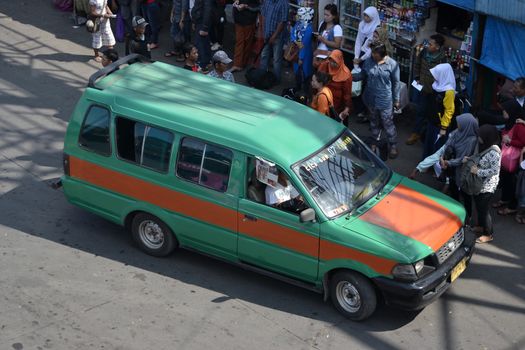 bandung, indonesia-june 16, 2014: public transportation in bandung city called angkot.