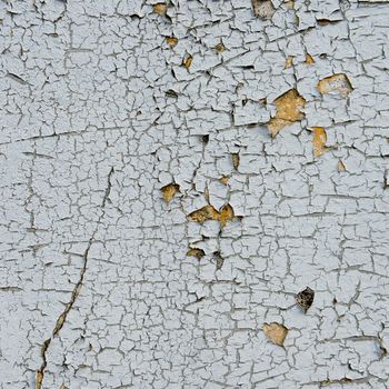 old cracked paint on the concrete wall 