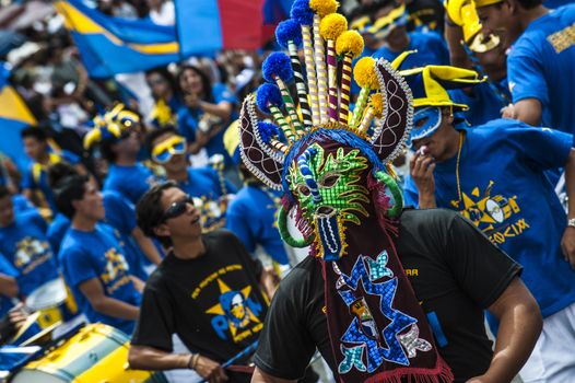 QUITO DECEMBER 5: People in traditional Ecuadorean masks dance as part of a parade through the streets celebrates its Spanish Foundation on December 5 2010 in Quito Ecuador