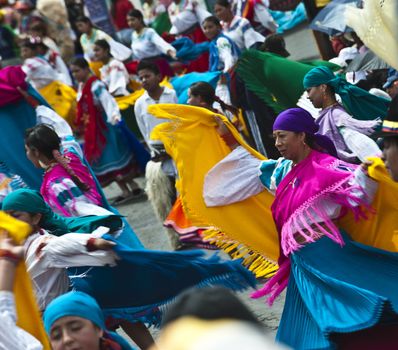 QUITO, DECEMBER 5: People in traditional Ecuadorean dresses dance as part of a parade through the streets celebrates its Spanish Foundation on December 5, 2010 in Quito, Ecuador