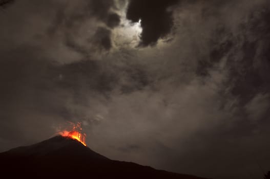 Night eruption. Tungurahua Volcano, Banos, Cordillera Occidental of the Andes of central Ecuador, South America