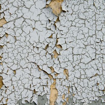 old cracked paint on the concrete wall 