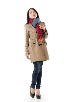 Attractive Asian lady with coat in winter, full length portrait isolated on white background.