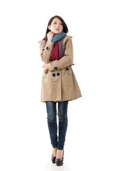 Attractive Asian lady with coat in winter, full length portrait isolated on white background.