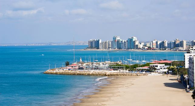 Salinas beach with apartment buildings and yacht club in Ecuador, Pacific Coast