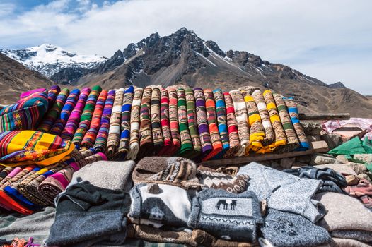 Traditional woven fabrics for sale at a tourist spot in the high Andes