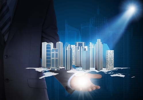 Man in suit holding city of skyscrapers in the hand. Spotlight shines skyscrapers