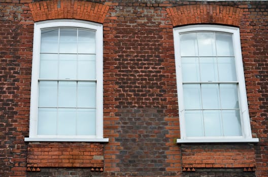 Two windows in red brick