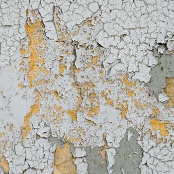 old cracked paint on the concrete wall 