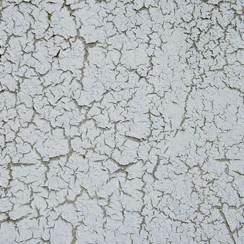 old cracked paint on the concrete wall 