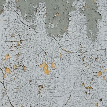 old cracked paint on the concrete wall 