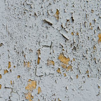 old cracked paint on the concrete wall 