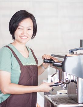 Woman barista enjoy at work, stock photo