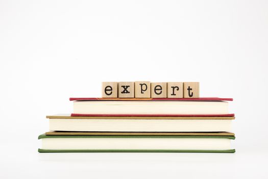 expert word on wood stamps stack on books