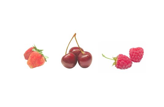 Raspberries, cherries and strawberries on a white background