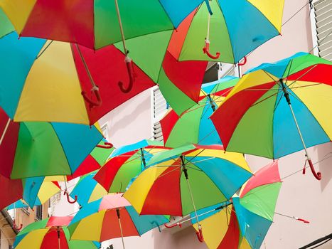 a lot of open multicolored umbrellas, street decoration 