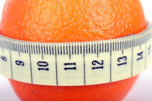 Supple orange with a tape measure - symbol of the fight against cellulite.