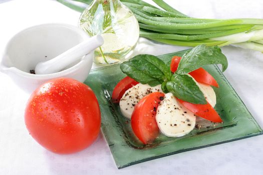 Salad with lettuce, tomato, cucumber, onion, olives clearing sauce.