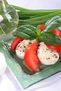 Salad with lettuce, tomato, cucumber, onion, olives clearing sauce.