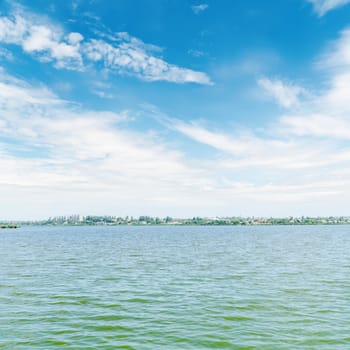 river and blue sky with white clouds