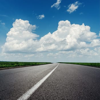 clouds on blue sky over asphalt road