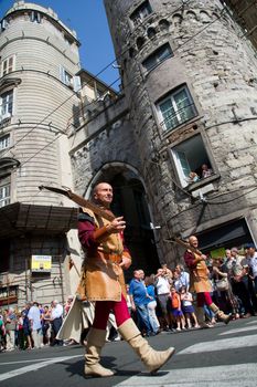 GENOA, ITALY - 8 JUNE 2014 - Unidentified people during the historical parade of the Maritime Republics Palio