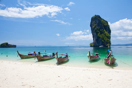 Cliff and boats and the clear sea Phi Phi Leh south of Thailand