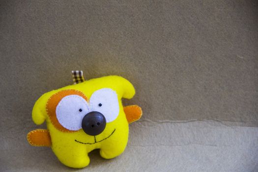 small small  beautiful smille  yellow textile dog