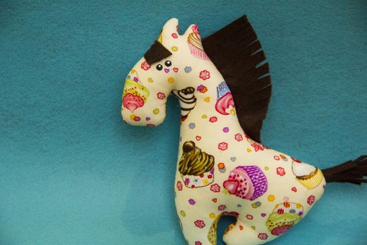 big  textile horse abric in the pattern of Cake