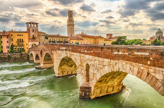 Ancient Roman Bridge called Ponte di Pietra above the Adige River in Verona, Italy