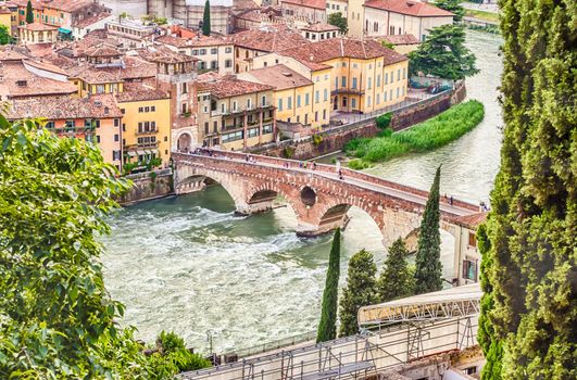 Ancient Roman Bridge called Ponte di Pietra above the Adige River in Verona, Italy