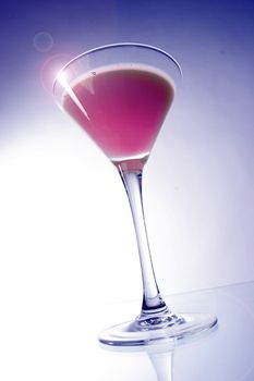 Colored drink in a glass for cocktails