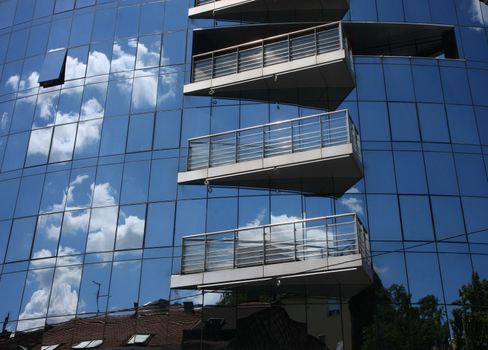 Reflection of old hauses and sky in the modern glass huose in Belgrade,Serbia