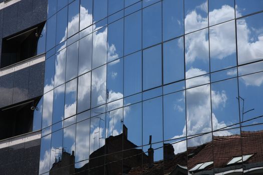 Reflection of old hauses and sky in the modern glass huose in Belgrade,Serbia