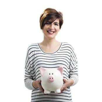 Beautiful happy woman with a piggybank, isolated over a white background
