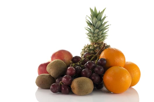 fruit as oranges pineapple grapes and kiwi isolated on white