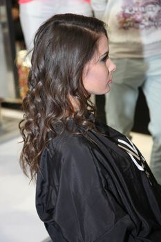 Model showing haircut and hair after special treatment at 23th iinternational fair and congress of cosmetics, solarium, equipment, wellness, spa and hair care, the largest beauty fair in South-east Europe, The touch of Paris, 26th and 27th April 2014. Belgrade,Serbia