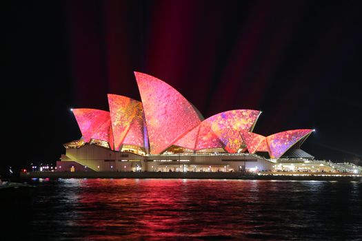 SYDNEY, AUSTRALIA - JUNE 2, 2014;  Vivid Sydney Festival, beautiful bright pink and yellow imagery projected onto the  Sydney Opera House  during Vivid  annual festival of light, music and ideas