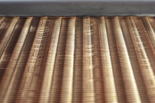 fragment of industrial copper air heat exchanger: focus on top part of radiator