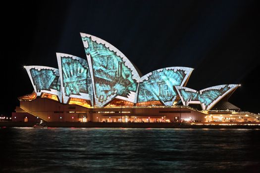 SYDNEY, AUSTRALIA - JUNE 2, 2014;  Sydney Opera House tiles fly off revealing the internal infrastructure architecture during Vivid Sydney annual festival