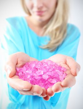 Female hands they keep colored crystals