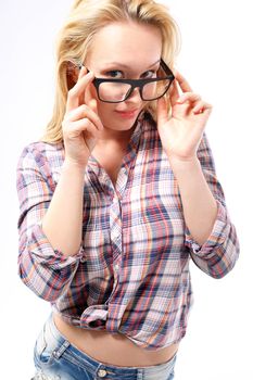 Fashionable, sensual blonde girl in stylish glasses dressed in shirts and shorts