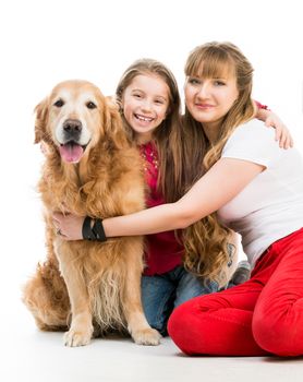 woman and little girl with a red retriever on white background